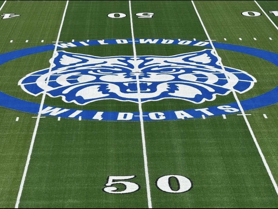 The Wildwood Wildcats logo painted at midfield on the 50-yard line.