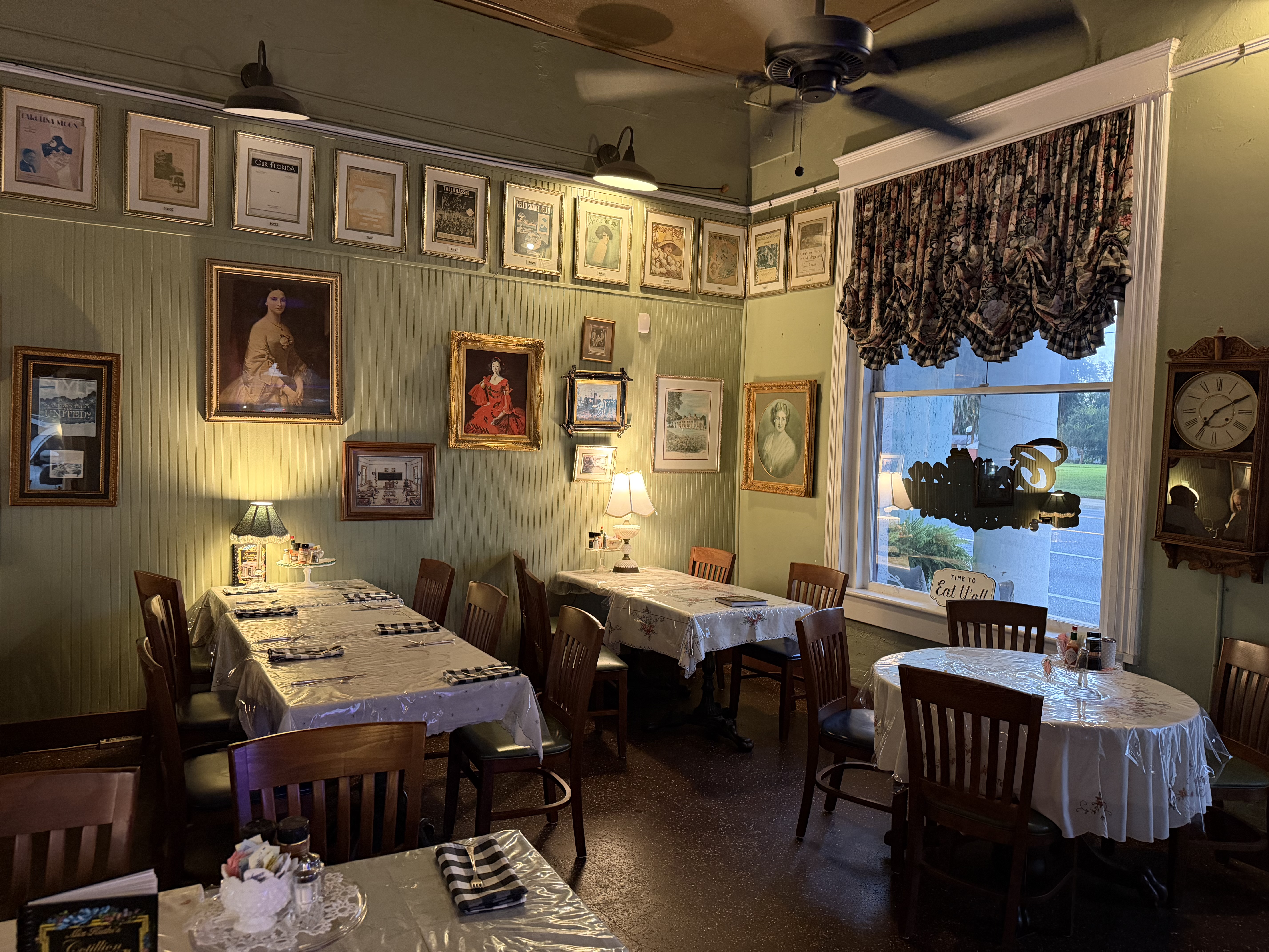 Restaurant with framed art and vintage decor